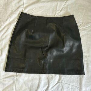 Black pleather miniskirt from with slight stretch